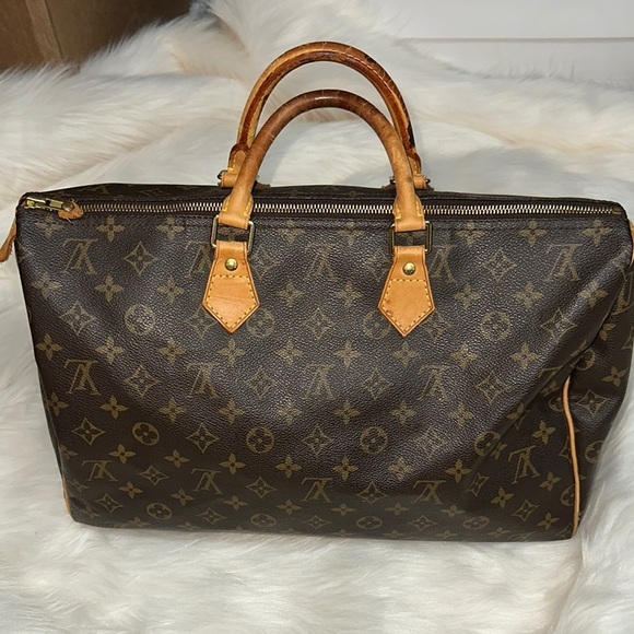 Louis Vuitton Brown Duffel Bag with Monogram Pattern and Leather Handles - Picture 1 of 8